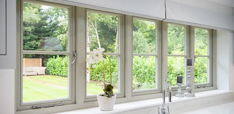 Premium Timber Windows installed in a kitchen overlooking a country garden